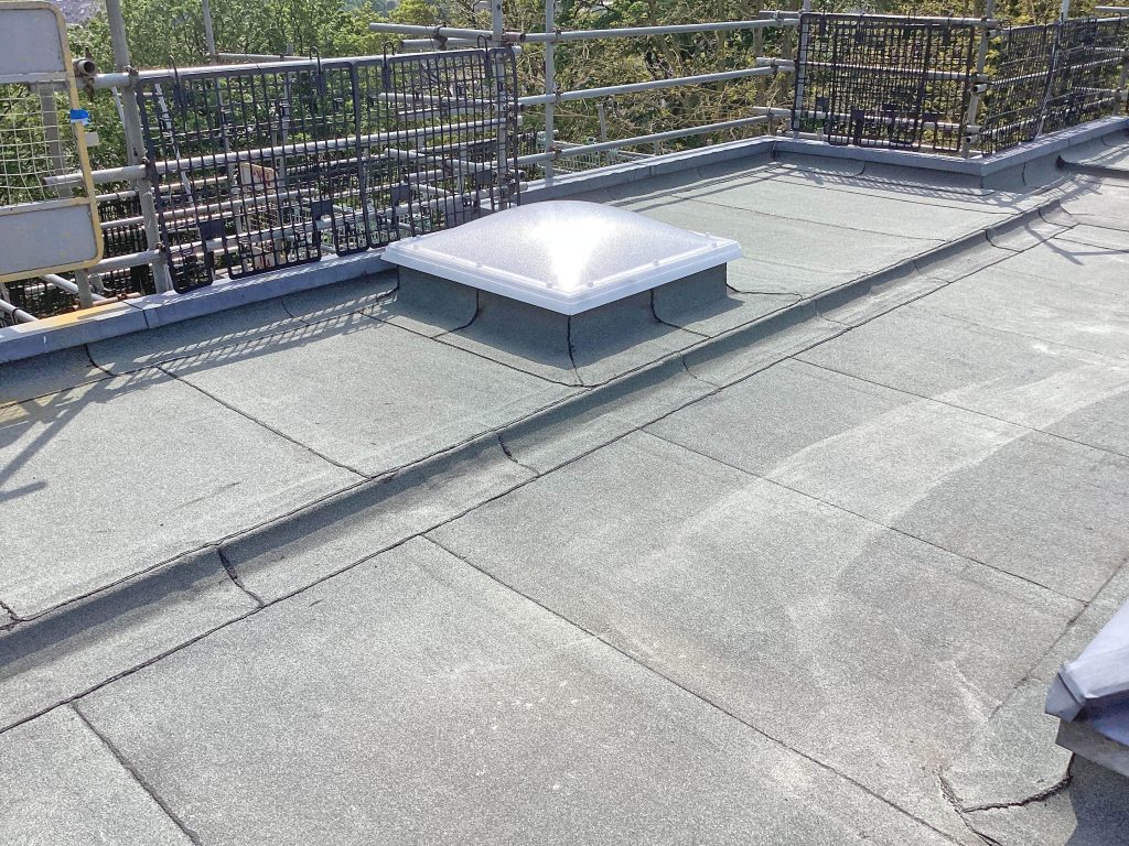 Close-up view of newly refurbished flat roof by Central Group, featuring clean lines and quality workmanship.